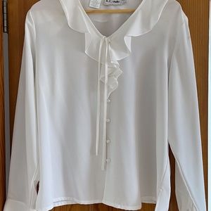 White ruffled blouse